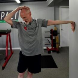 Neck Pull With Palm on Wall